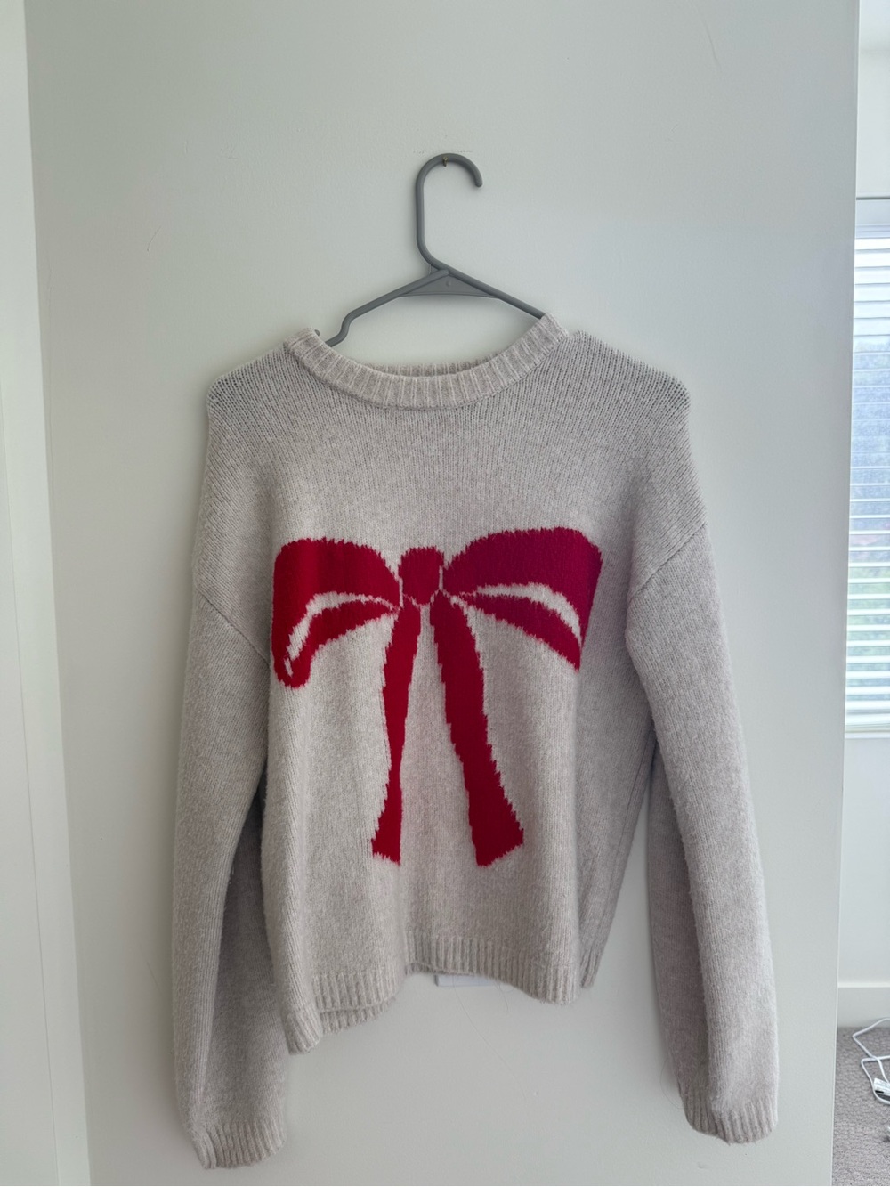a new day Cream Crewneck Sweater with Red Bow Graphic
